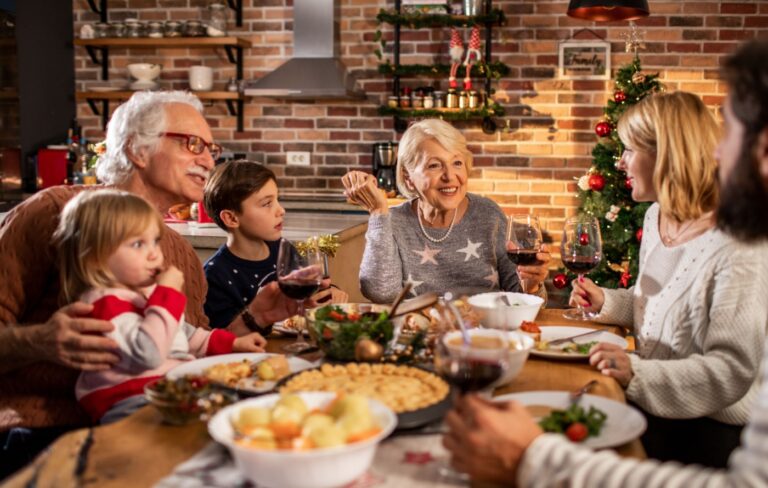 Happy multigenerational family eating Christmas dinner