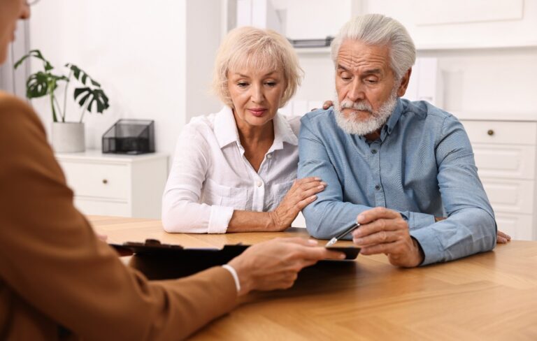 Senior couple consulting a financial planner