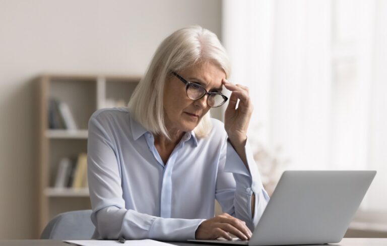 Senior businesswoman concentrating on her laptop
