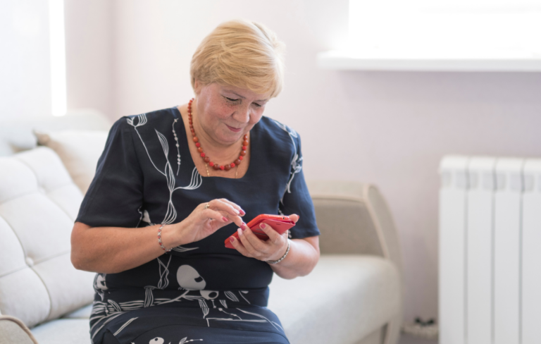 Senior woman looking at her mobile phone