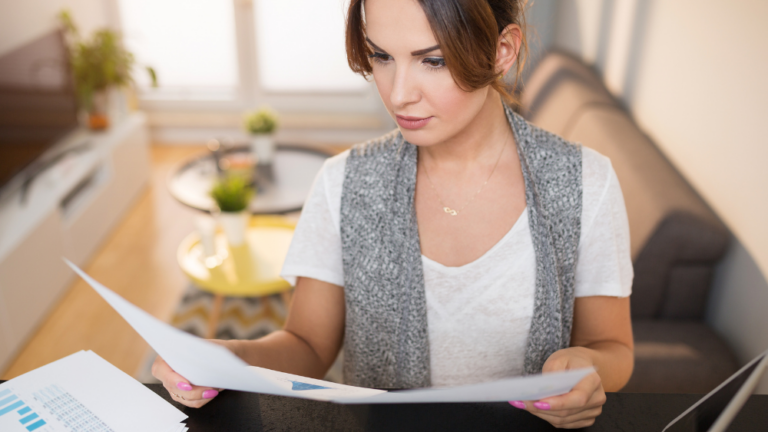A young woman looking at financial paperwork