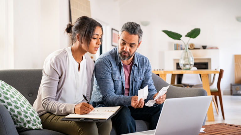 Middle-aged couple looking at paperwork